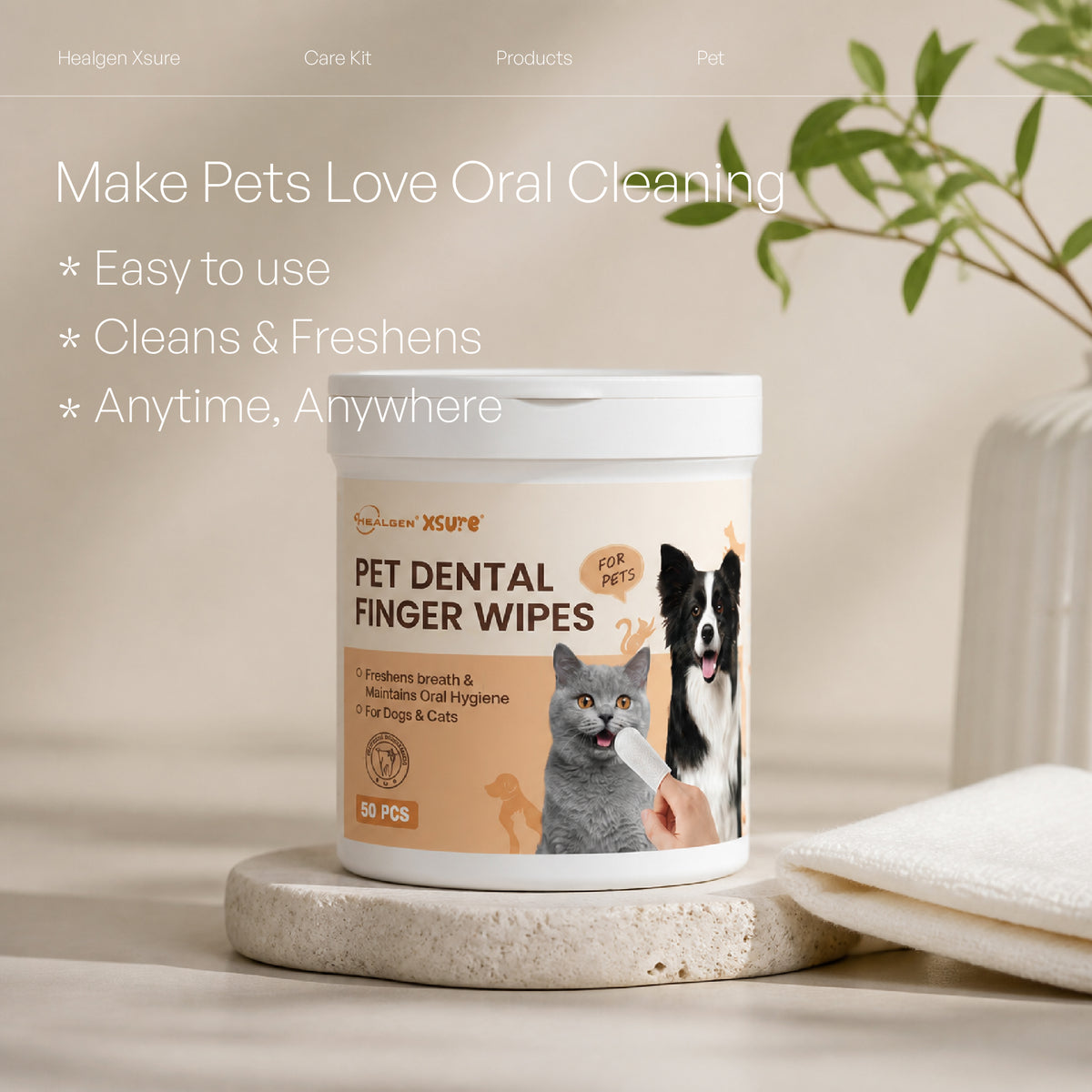 A white tub of XSure Pet Dental Finger Wipes sits on a stone coaster with a folded white cloth beside it. The label shows a dog, cat, and hand, with text reading 'Pet Dental Finger Wipes' and 'Make Pets Love Oral Cleaning.
