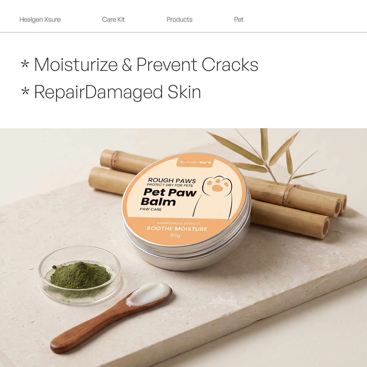 A tin of Rough Paws Natural Pet Paw Balm sits on a stone slab with bamboo sticks, a small dish of green powder, and a wooden spoon with white balm. Text at the top reads 'Moisturize & Prevent Cracks' and 'Repair Damaged Skin'.